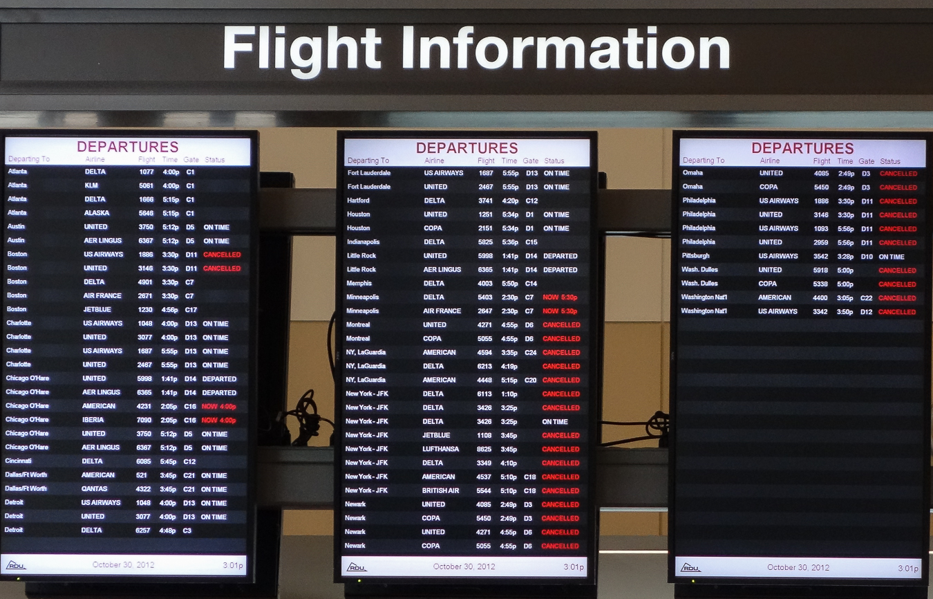departing-flights display at RDU airport, 3:01 pm, October 30, 2012