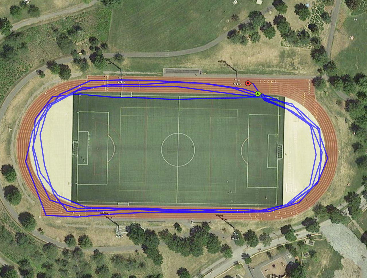 Google maps satellite view of Danehy Park track, with overlay of GPS-recorded trajectory of four laps